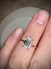 Silas 1.57 carat lab grown diamond engagement ring in emerald cut with thin band and hidden halo handmade in recycled 14k yellow gold on hand 