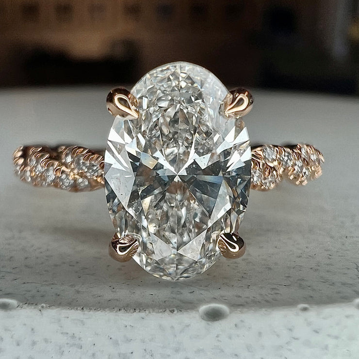 Suzette 1.47 carat oval lab grown diamond engagement ring in 18k rose gold with twisted diamond band with micro-pave white diamonds 