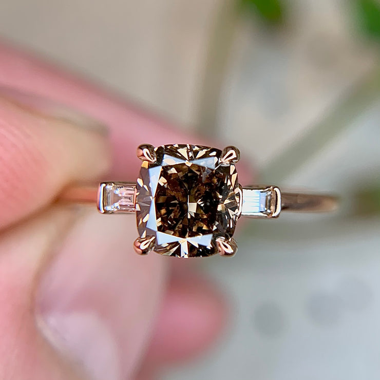 1 carat cushion cut diamond engagement ring with baguette side stones in rose gold by Dana Walden Bridal NYC