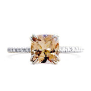 Peach sapphire engagement ring set in platinum. Ethically handmade in New York City. Dana Walden Bridal.
