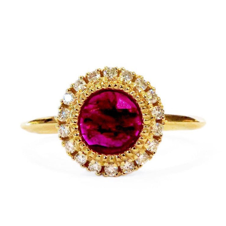 Yellow gold ruby ring with diamond halo by DANA WALDEN NYC.