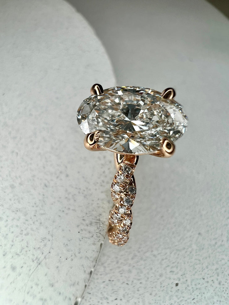 Suzette 1.47 carat lab grown oval diamond ring with twisted diamond paved band in 18k rose gold