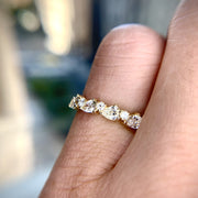 Diamond wedding band with alternating pear-shaped white diamonds and round diamonds. DANA WALDEN BRIDAL NYC.