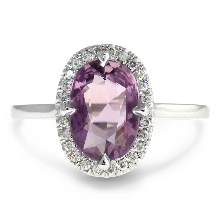 Oval lavender sapphire engagement ring with conflict free diamond halo. DANA WALDEN NYC.