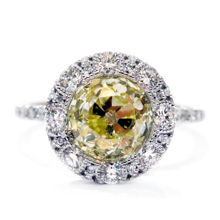 Old mine yellow diamond  with white diamond halo. DANA WALDEN BRIDAL NYC.