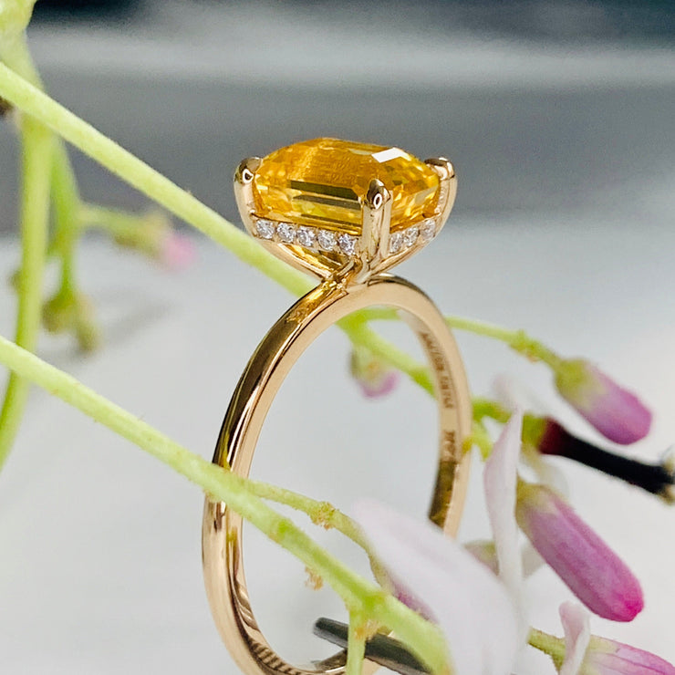 Alternative Yellow sapphire engagement ring in emerald cut on delicate gold band