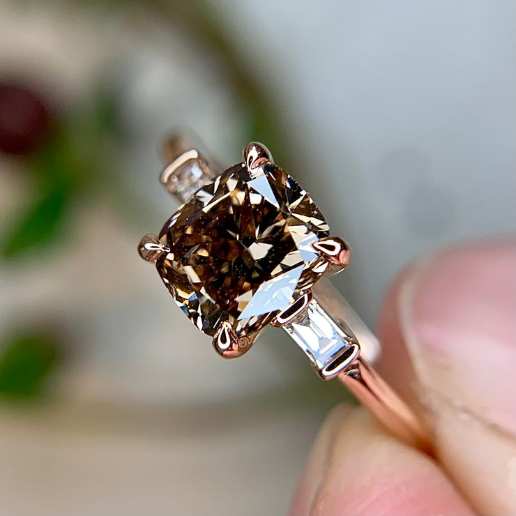 1 carat cushion cut engagement ring with baguette diamond accents in rose gold by Dana Walden Bridal NYC, side profile