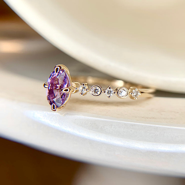 Purple sapphire engagement ring in yellow gold with diamond accents in yellow gold, side profile, by Dana Walden Bridal NYC