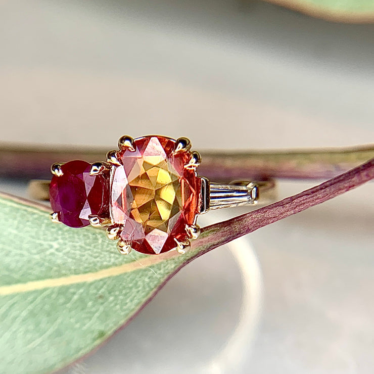 Orange sapphire, ruby, and diamond baguette cluster engagement ring in yellow gold by Dana Walden Bridal NYC