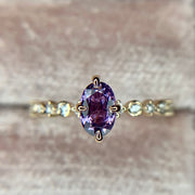Purple sapphire engagement ring in yellow gold with delicate diamond band by Dana Walden Bridal NYC