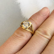 Dana Chin wearing a handmade gold engagement ring on his pinky finger.