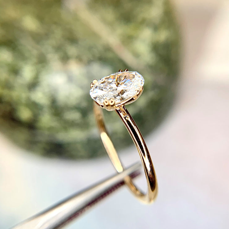 Oval cut lab diamond engagement ring in 14k yellow gold. Dana Walden Bridal NYC.