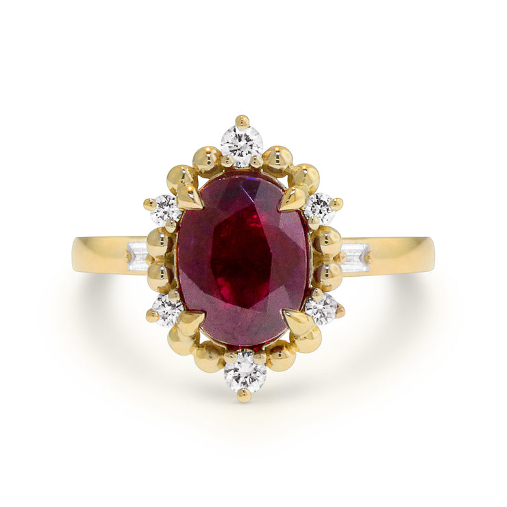 Harkin ruby ring with gold and diamond halo. DANA WALDEN BRIDAL, NEW YORK CITY.