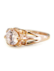 White sapphire and rose gold engagement ring by Dana Walden Bridal in New York City.
