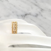 three gold stacking wedding rings by DANA WALDEN NYC.